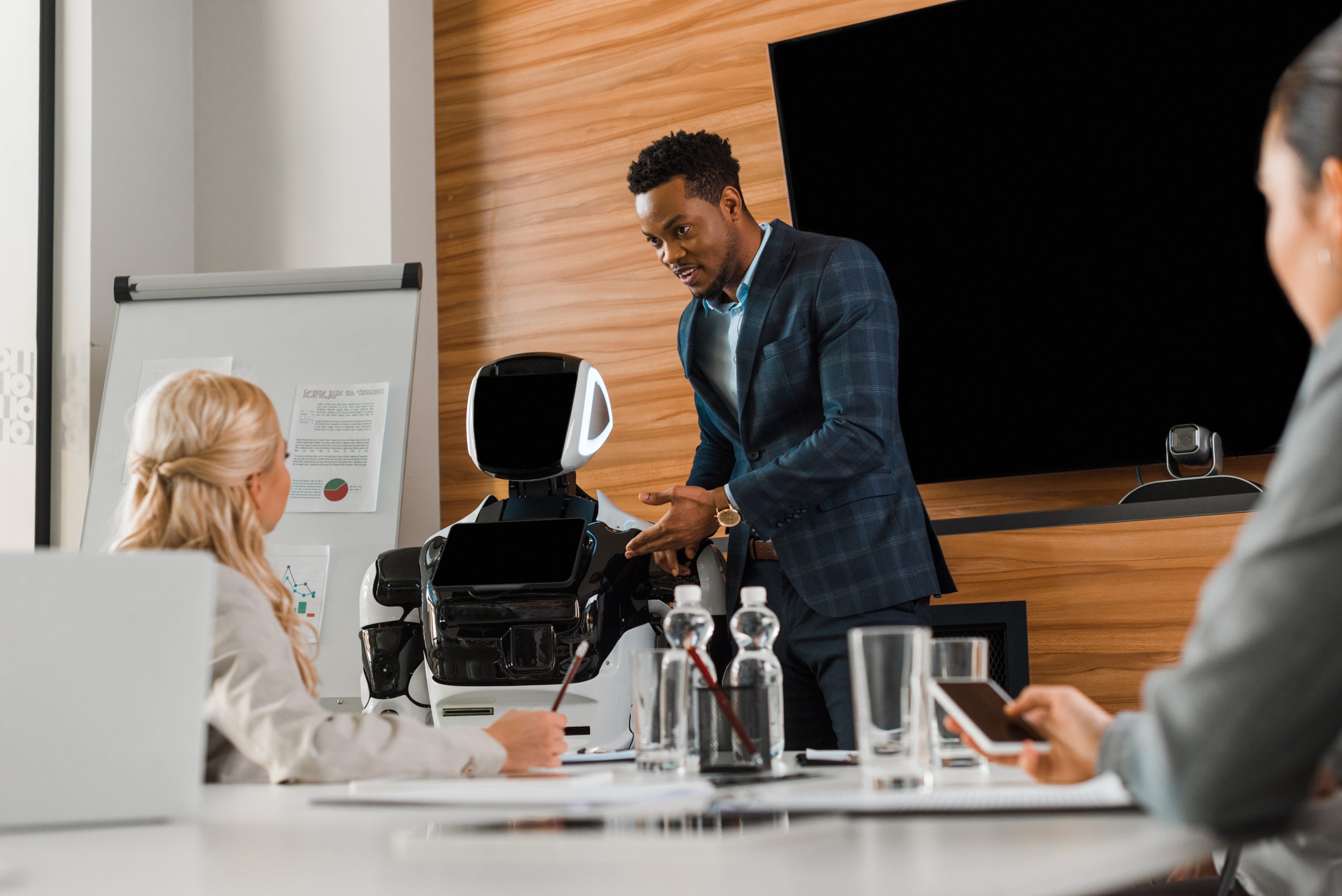 business professionals collaborate with robot in m 2026 01 06 00 15 35 utc scaled